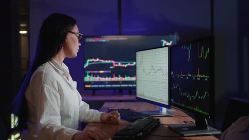 Cryptocurrency Stock Market Woman Trader Investor Analyst Looking at Computer Monitor