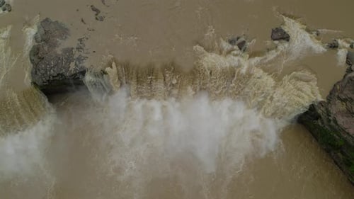 Aerial shot of a powerful waterfall in nature