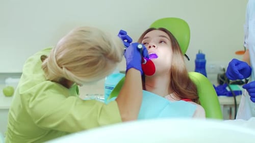 Young woman receiving dental care at the dentist