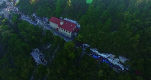 Amazing monastery on the rock covered with greenery.