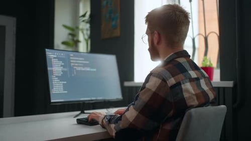 Machine Learning Engineer Freelancer Working in Home Office or Coworking Space Rear View
