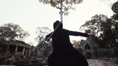 Masked Figure Swordsmanship in Ancient Stone Ruins