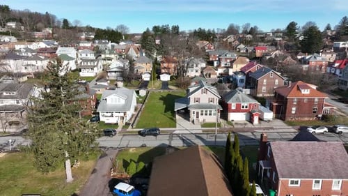 Aerial truck shot of homes in small town in USA. Establishing shot of rural neighborhood community.