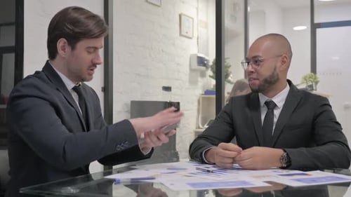 Businessman Giving Money to Partner after Meeting