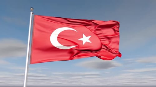 Waving Turkish Flag on a Clear Blue Sky