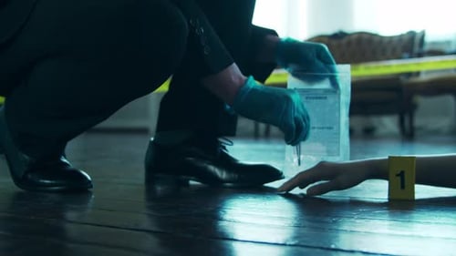 Forensic Investigator Collects Evidence at Crime Scene
