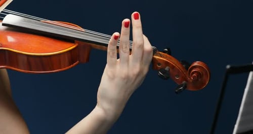 Woman Plays Violin in Close Up Shot