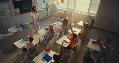 Smart Children Raising Hands Primary School Girl Showcasing Knowledge of Ecology in Front of Class