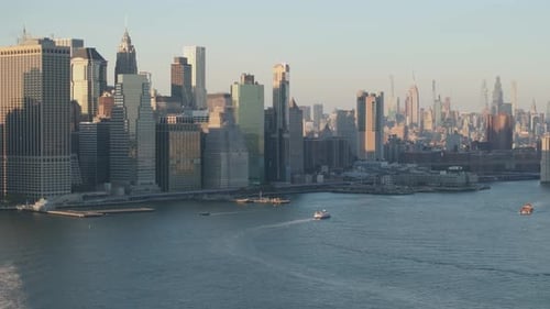 Establishing shot of New York City. Shot with a drone above the East River.