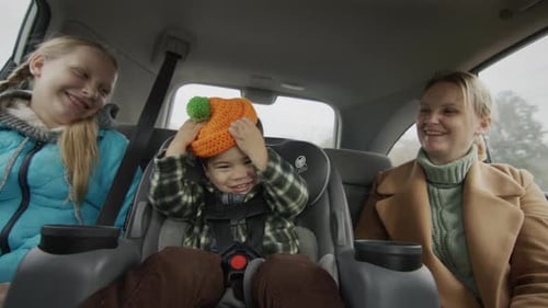 Loving Family Smiles Together Inside Car
