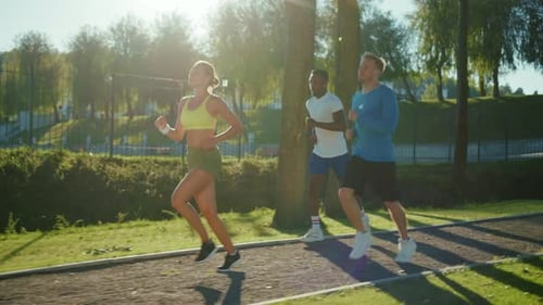 Three Attractive Young People Jogging Together in Beautiful Landscape on Sunny Morning Sports Dream