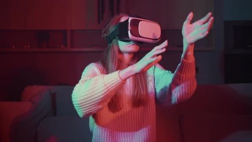 Woman Using Virtual Reality Headset at Home