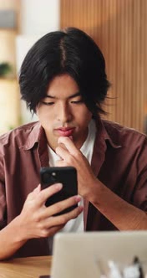 Excited, asian man and winning with phone in home for good news, online trading or profit
