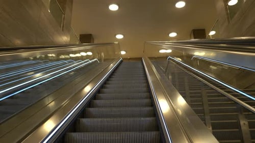 Escalators at train station and lit area