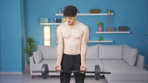 Man Doing Bicep Curls at Home