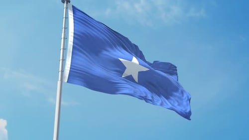 Realistic Waving Flag of Somalia Against Blue Sky