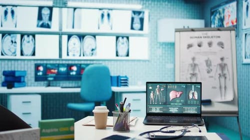 Empty Medical Office with Computer and Diagnostic Tools Set Up for Consultations