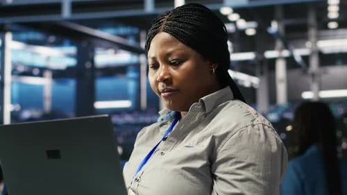 Cheerful Data Center Employee Using Node Tree Software to Analyze Datasets