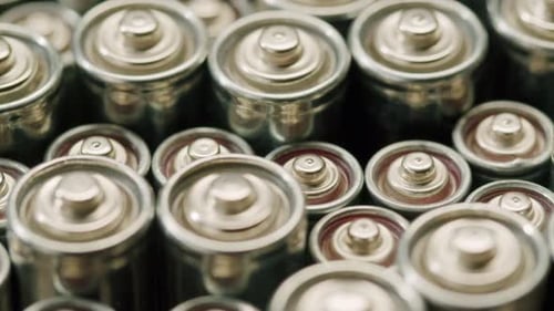 Silver Batteries AA and AAA on Black Background Closeup DoubleA Battery is a Standard Size Single