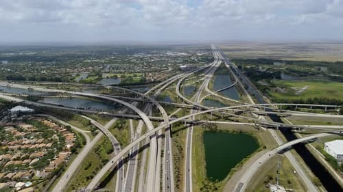 A Raised Highway Interchange in Miami Bustling with Moving Vehicles Showcasing Transportation
