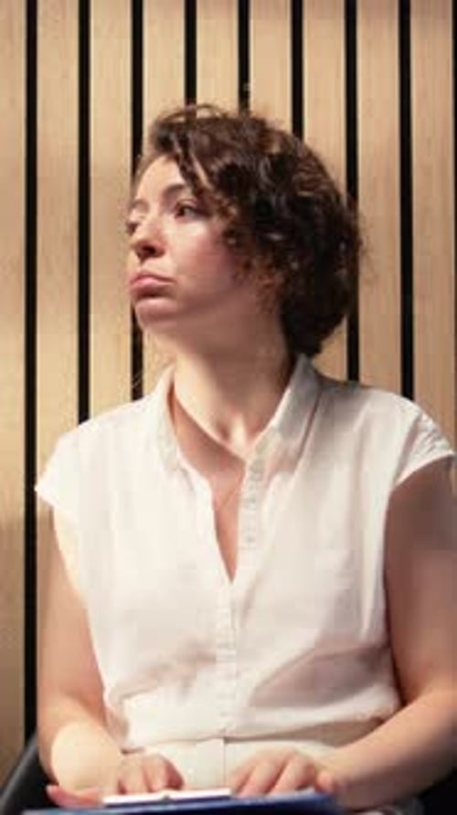 Vertical Video Close Up of Female Job Applicant Being Nervous and Shaking in the Hallway