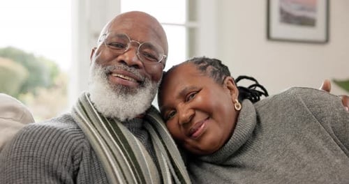 Smiling Senior Couple Posing Together on Couch