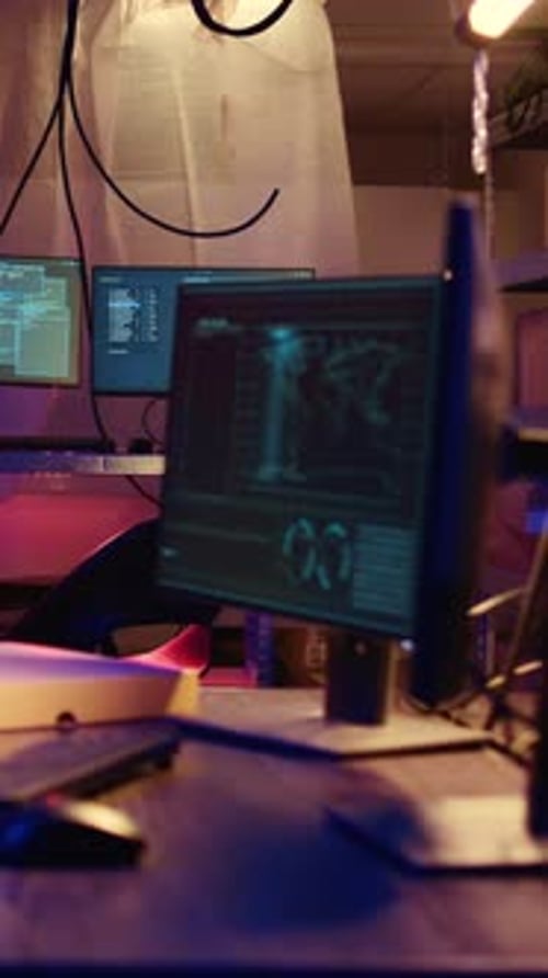 High Tech Room with Multiple Computer Monitors at Night