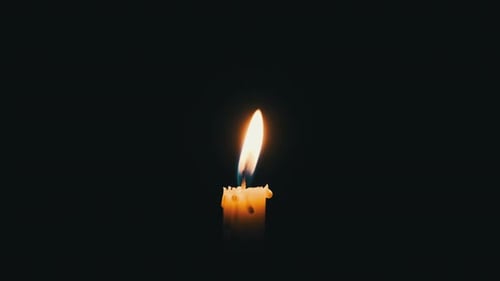 Single Candle Burning Brightly in the Dark