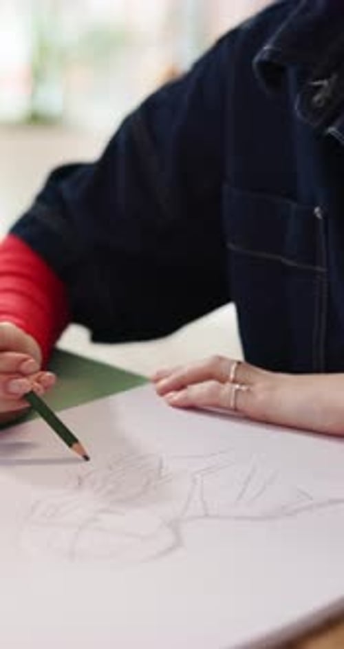 Drawing, pencil and hands with paper in studio, creativity and visual arts course for technique