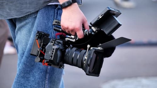 Filmmaker Holding Professional Video Camera Rig for Production