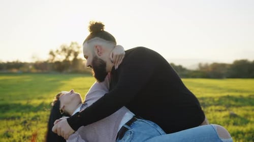 Happy Lovely Couple Dance Together in the Meadow During Valentine's Day