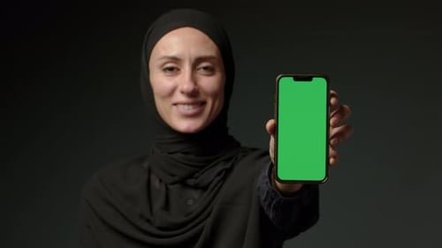 Portrait Smiling Arabian Lebanese Girl Muslim Islamic Woman in Hijab Hold Smartphone in Front Show