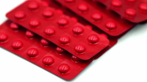 Pile of Red Pills in Blister Packs