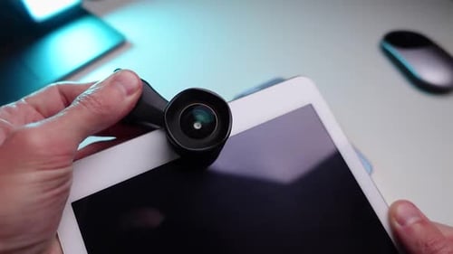 Attaching a Lens to a White Tablet Camera