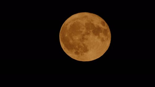 Ethereal Moon Moving Across the Night Sky