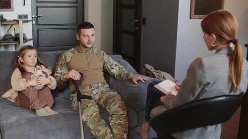 Man and Girl in Counseling Session with Therapist