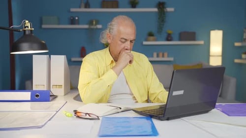 Home office worker old man thinking creatively.