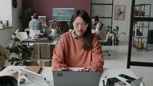 Timelapse of Young Biracial Woman Working on Code at IT Company