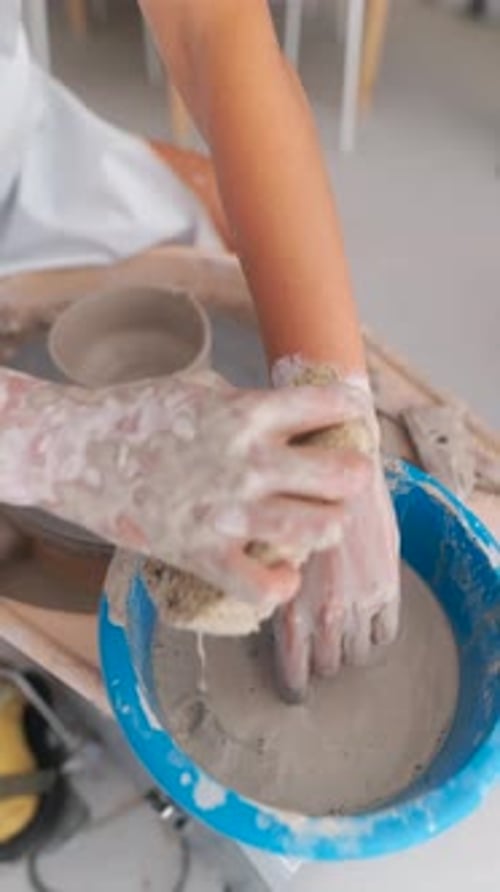 Pottery Artist Working Clay on Wheel
