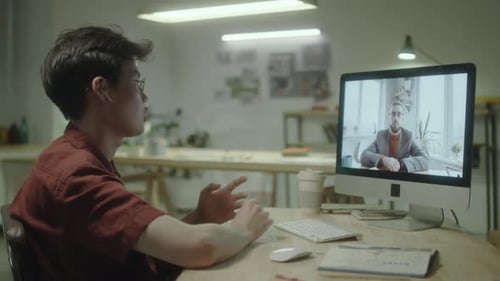 Young Adult on Video Conference Call in Office