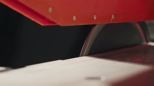 Closeup of Carpenter Cutting a Wooden Plank Circular Saw on Wooden Factory Furniture Production