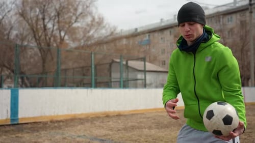 Urban Soccer Freestyle Performance Closeup of Street Performer with Ball Male Street Artist