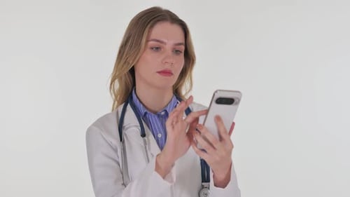 Woman Doctor Using Mobile Phone in a Hospital