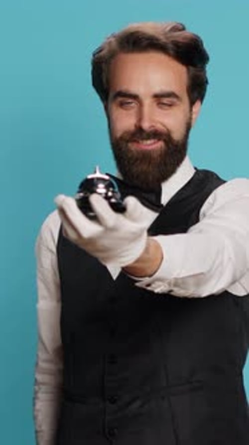 Man Rings Silver Bell with White-Gloved Hand