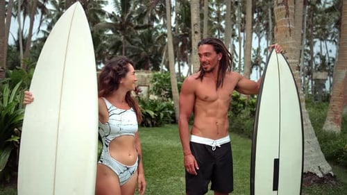 Couple of People with Surfboards in Green Summer Nature of Sea Beach and Ocean