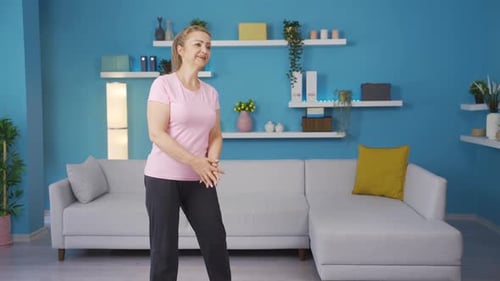 Woman Stretching Legs for Fitness at Home