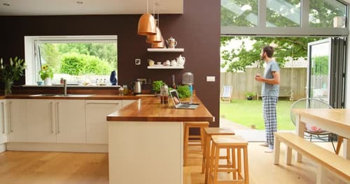 Man Works from Home in Kitchen