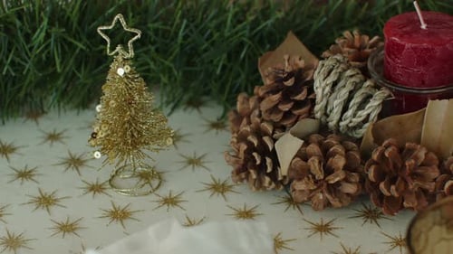 Festive Christmas Decor on Table with Gold Christmas Tree