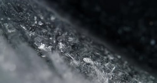 Microscopic shot of alchol ink mix, creating monochrome abstract patterns and shapes