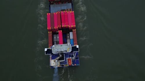 Intermodal Transport Loaded With Containers Sailing On The River In Dordrecht, Netherlands. aerial t